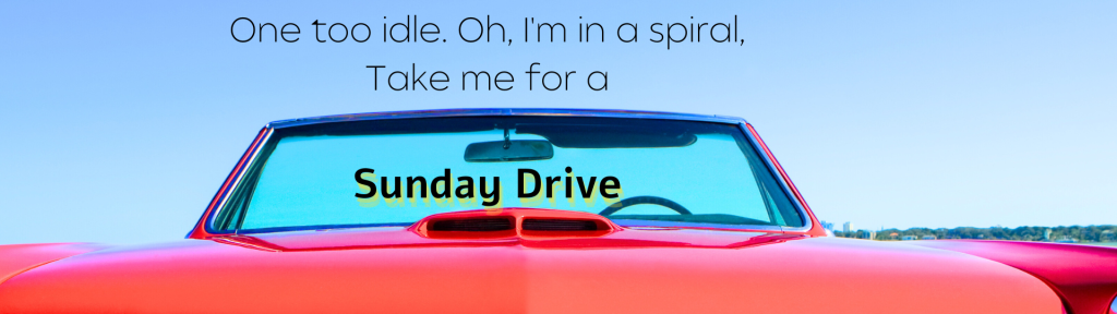 The backdrop is a red convertible with the top down, against a clear blue sky. In thin black text in the space above the car: One too idle, oh I'm in a spiral, Take me for a. In thicker bold black text, with a yellow highlight, in the space of the spy visible in the windshield: Sunday Drive.